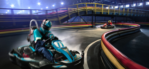 Two cart racers are racing on the grand track
