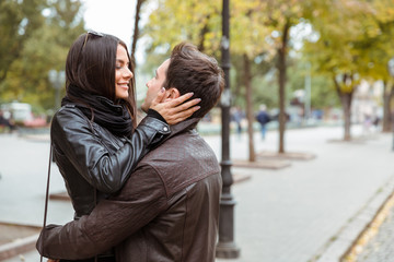 Woman embracing with her boyfriend outdoors