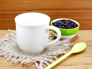 coffee cup with coffee beans still life