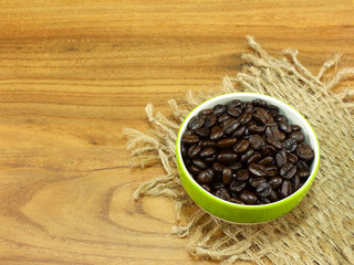 coffee beans on wooden background still life