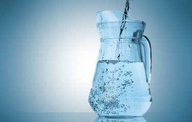 Water pouring into pitcher