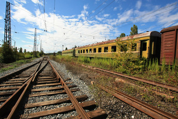 Fototapeta na wymiar Abandoned train at the old railway