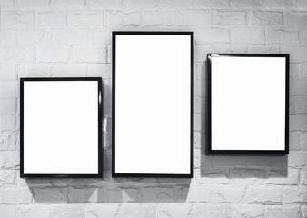 Mock up Light box frame deisign template on white brick wall