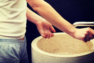 Woman cleaning her hands.