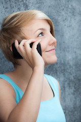 Attractive teenage girl using smart phone