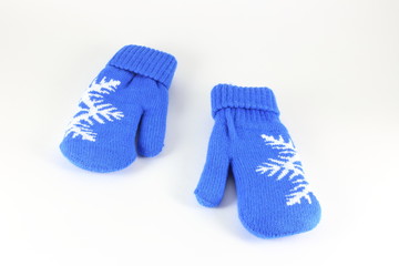 Pair of knitted mittens with pattern snowflake, isolate on white