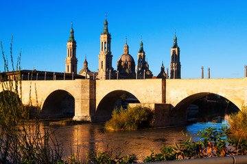 antique stone bridge and  Cathedral in   Zaragoza,  Spain