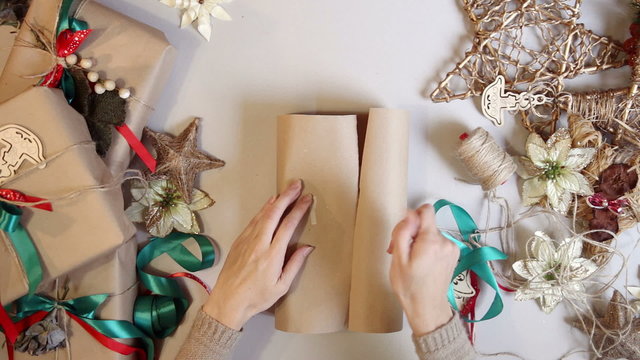 Top view. wrapping christmas presents. time lapse