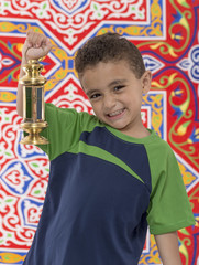 Adorable Young Boy with Small Ramadan Lantern