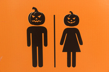 Scary Halloween pumpkin, Ghost man and woman on orange background, Halloween sign.