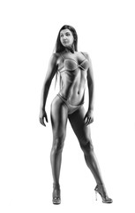 fitness woman in sport style standing against white background