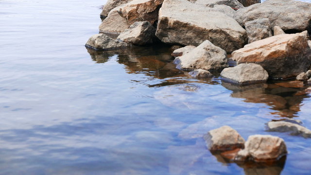 Stones on  transparent river bank close up.4K (3840x2160