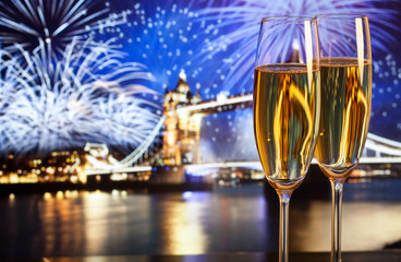 New Year celebration in the city - champagne glasses and Tower b