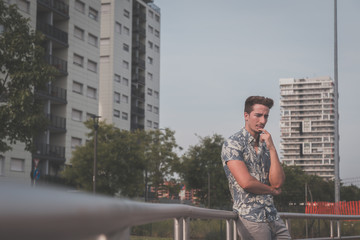 Young handsome man posing in the street