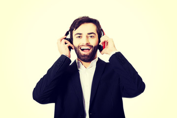 Businessman listening to music.