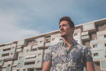 Young handsome man posing in the street