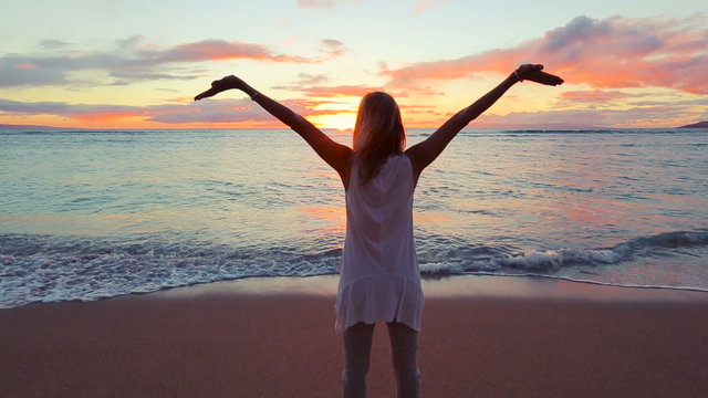 Beautiful Older Woman Enjoying a Sunset Walk on the Beach. Vacation Travel Retirement 