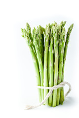 Obraz premium Bundle of asparagus on the white background vertical