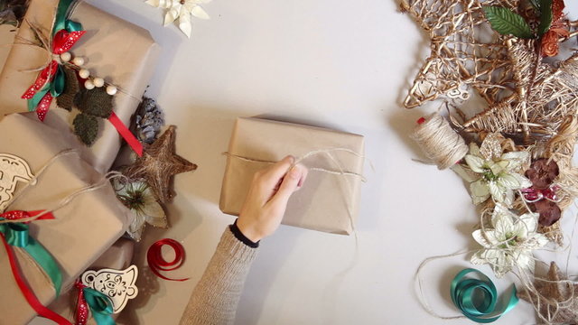 Top view woman wrapping christmas presents 