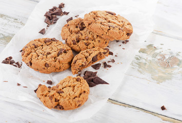 Chocolate chip cookies on baking paper.