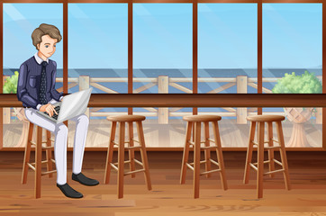 Man working on computer at the shop