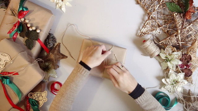 Top view. wrapping christmas presents. time lapse