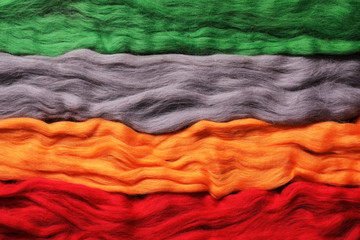 Multi-colored wool for felting - handicraft items. Background from wool. Different colours