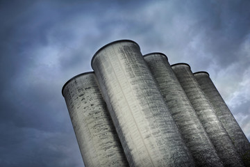 Silos and cloudy sky