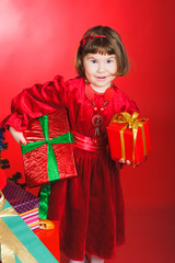 Happy girl holding two present boxes in her hands