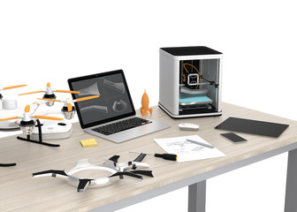 3D printer, laptop, tablet PC and drone on a table, concept for new technology for DIY.