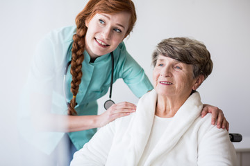 Fototapeta premium Young doctor and elderly patient