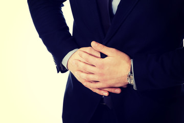 Obraz premium Businessman suffering from stomach pain.