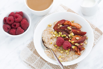 oatmeal with baked fruit, coffee with milk for breakfast