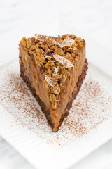 piece of apple and caramel cake on plate, top view