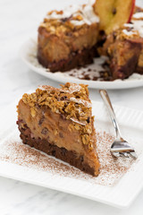 piece of apple and caramel cake on white plate