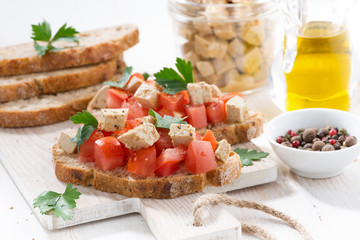 toasts with tomatoes and marinated feta