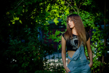 beautiful girl in denim overalls