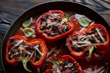 Close-up of baked bell peppers stuffed with minced beef meat