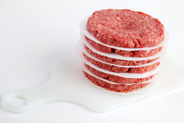 Raw fresh burger patties ready for cooking
