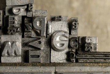 Metal Lettrpress Types.
A background from many historic typographical letters in black and white with white background.