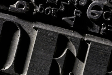 Metal Lettrpress Types.
A background from many historic typographical letters in black and white with white background. - obrazy, fototapety, plakaty