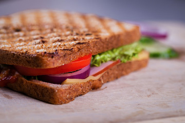Fresh homemade grilled sandwich on wood