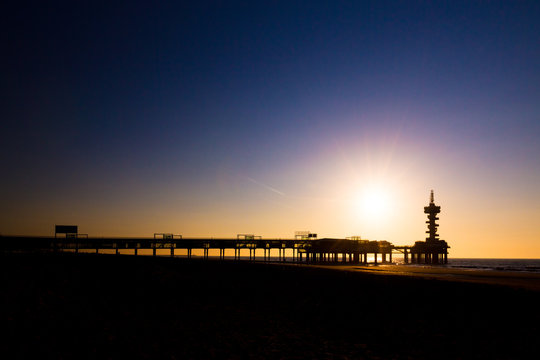 Evening silhouette of the pier of Scheveningen, the Netherlands 