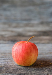 Apples on old wooden background.