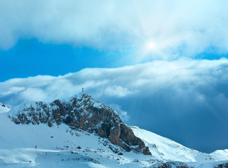 Fototapeta na wymiar Winter mountain slope with ski track.