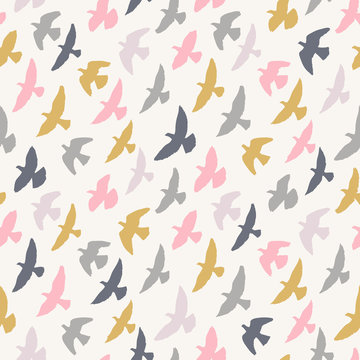 Seamless pattern of flying birds. Pastel background.