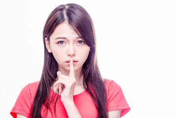 Naklejka premium Asian woman with finger on lips
