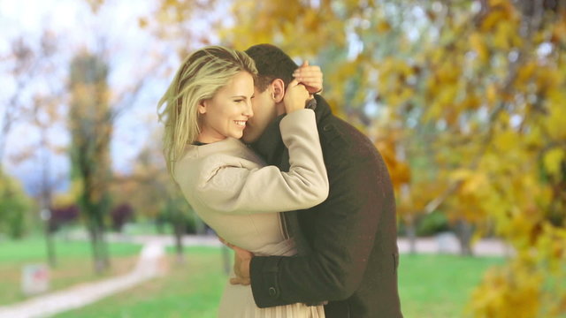 Man and woman  kissing beautiful in autumn park outdoor.