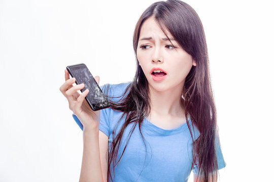 Chinese Woman Staring At Broken Cell Phone