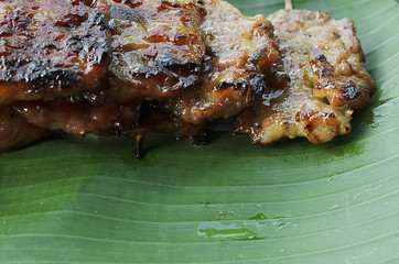 Delicious thai grilled pork macro close up right side background